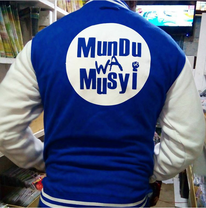 Mundu Wa Musyi College Jacket — Blue (Back)